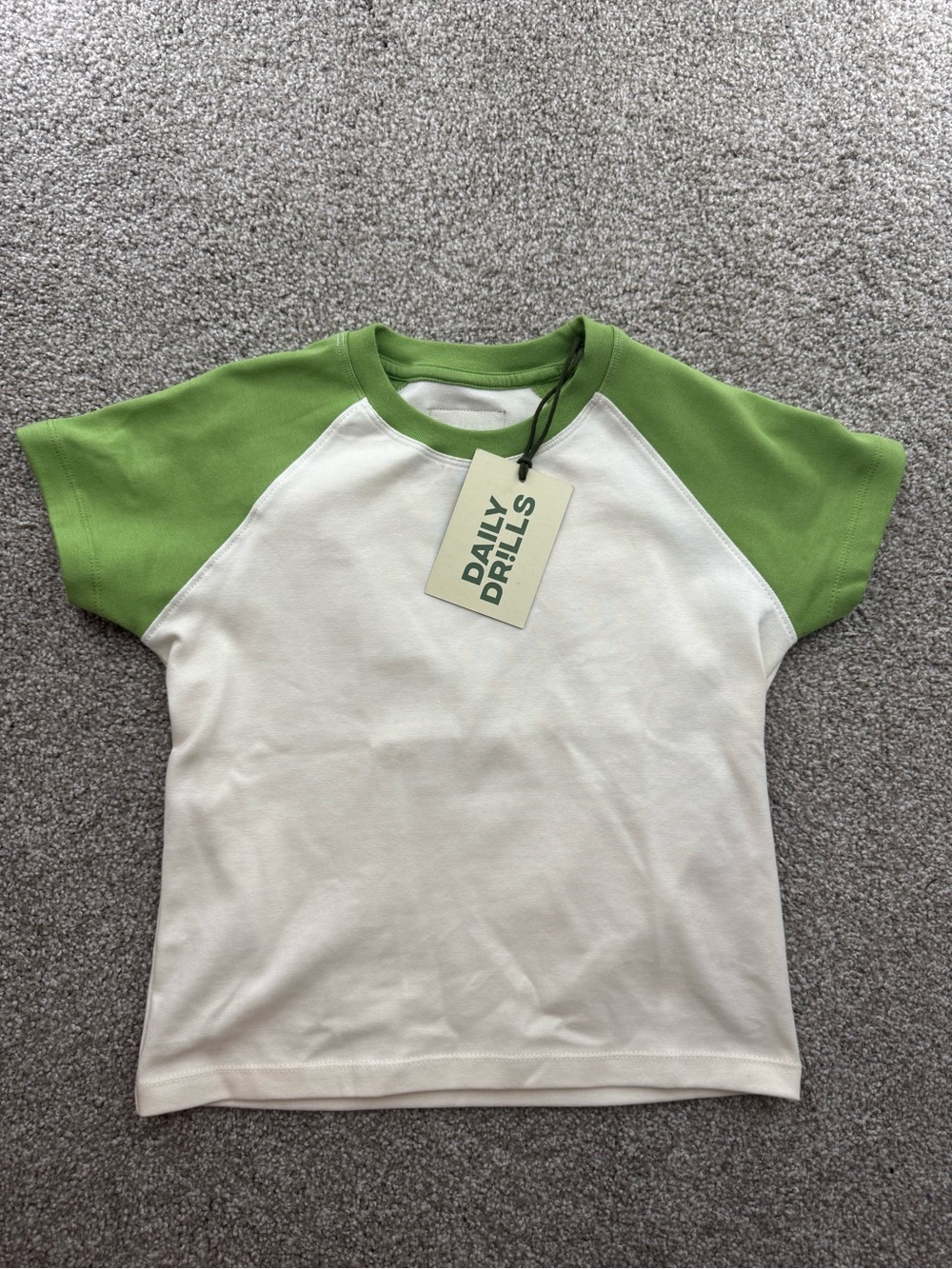 Daily Drills White Tee with Green Raglan Sleeves